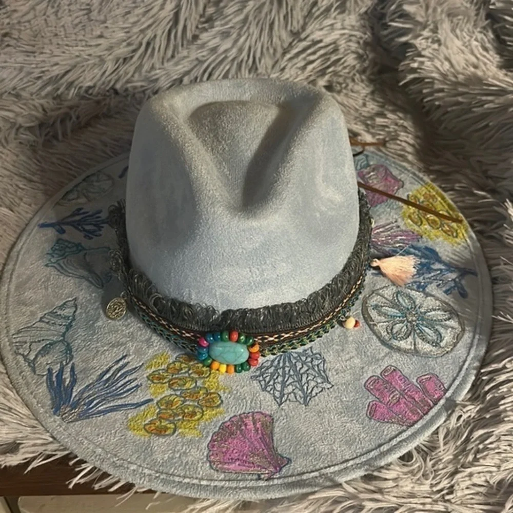 - Beautiful hand burned and hand painted cowboy hat. Great fit. Seashells